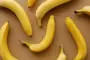 Ripe bananas top view on tan background color